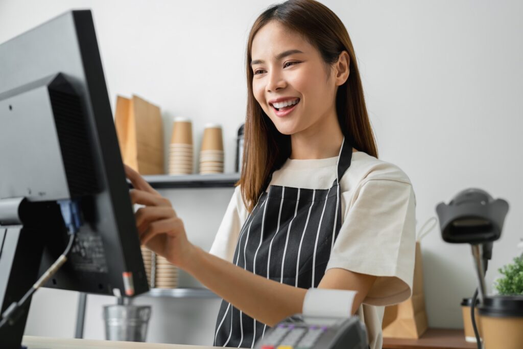 Independent grocer reviewing financial data to build a business case for a new POS system upgrade