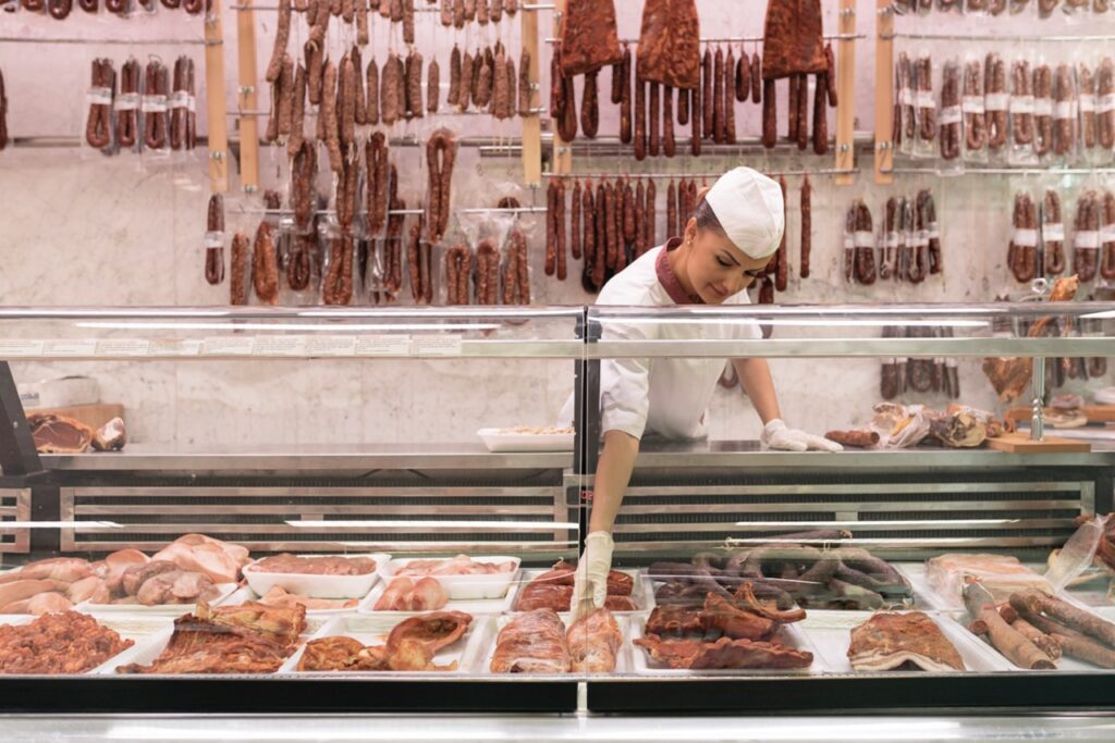 A butcher shop counter scale integrated with a POS terminal for weight pricing