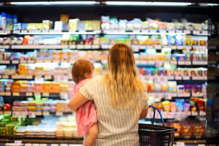 WIC participant using an eWIC card at a certified independent grocery store POS terminal