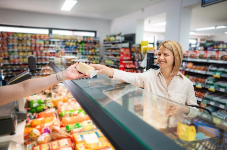 Grocery deli scale connected to the POS system printing a weighted item label at the counter