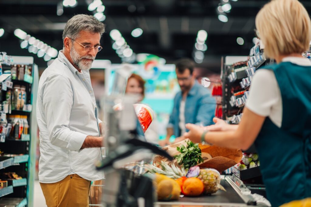 Grocery store checkout line waiting during a POS system outage