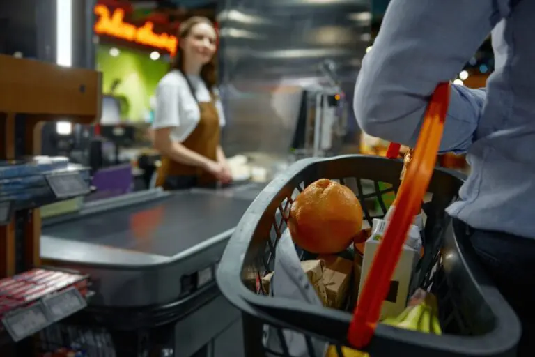 Grocery store manager reviewing hourly POS traffic data to build a staff schedule