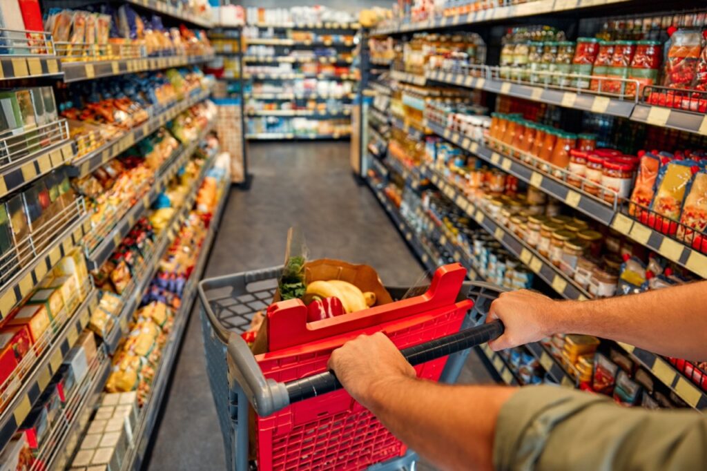 Grocery store owner monitoring two locations from a centralized reporting dashboard