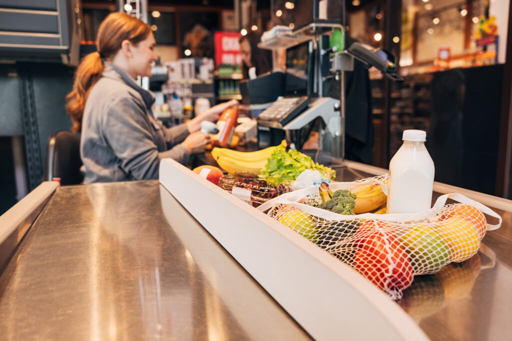 Multi-location grocery operator comparing FlexRetail Professional and Enterprise POS tier features