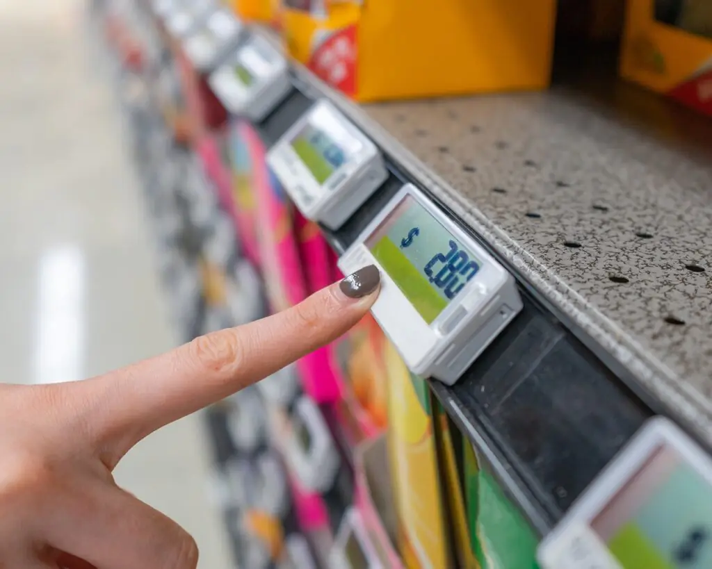 Grocery group operations manager reviewing multi-store grocery management dashboards