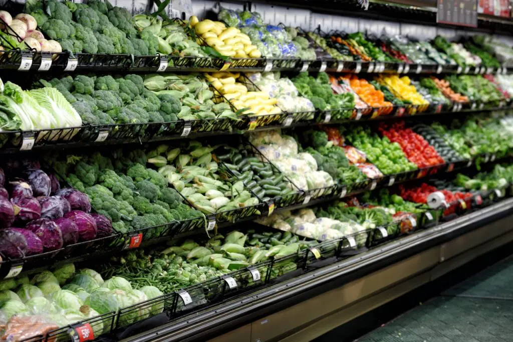 Clean, well-stocked produce section in an independent grocery store