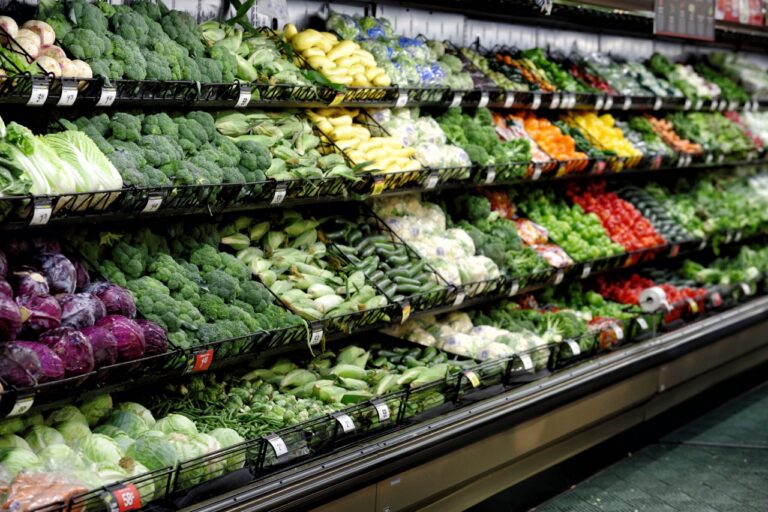 Clean, well-stocked produce section in an independent grocery store