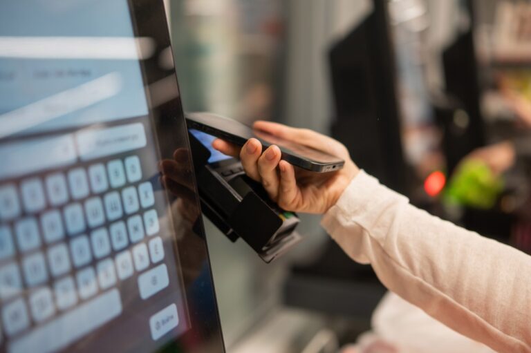 Customer paying at a grocery POS terminal set up to process both EBT cash and SNAP benefits